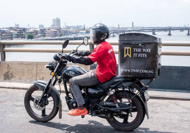 Everyday life in Lagos as a logistics delivery bike rides along a road on Third Mainland Bridge, Lagos, Nigeria on November 18, 2022.